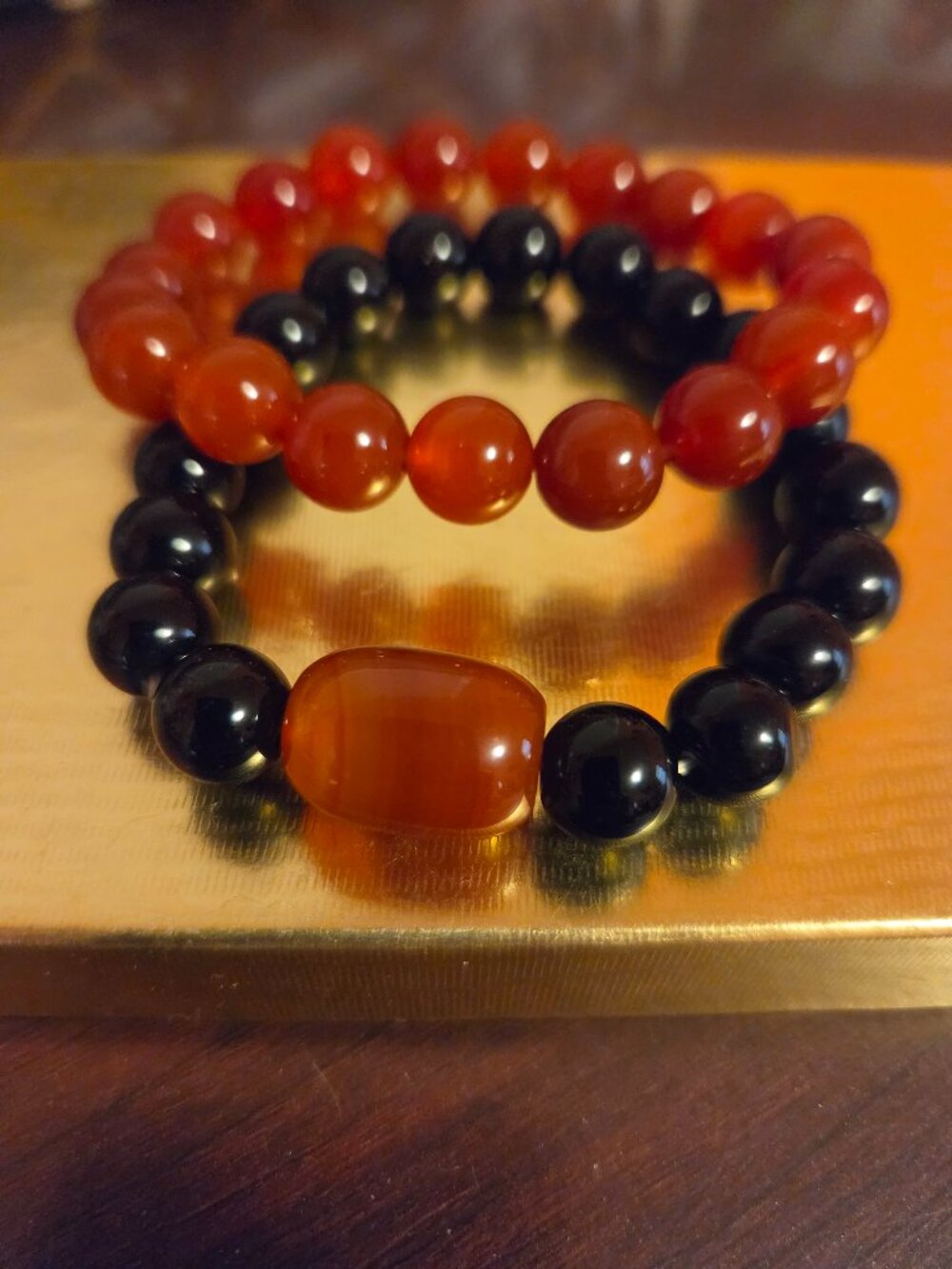 Two Bracelets Black Onyx and Carnelian .